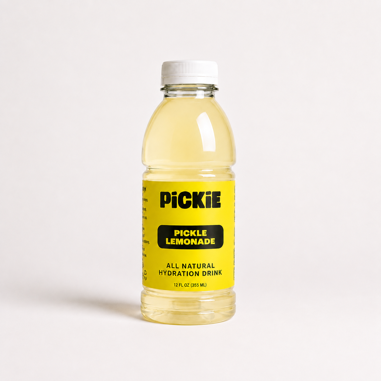A 12 fl oz bottle of Pickle Lemonade all natural hydration drink, featuring a bright yellow label with black text and a white cap, set against a plain white background.
