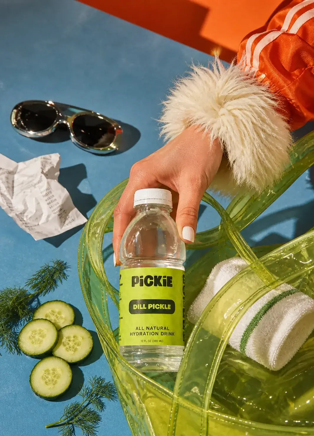 PiCKiE Dill Pickle being placed in a clear bag outdoors