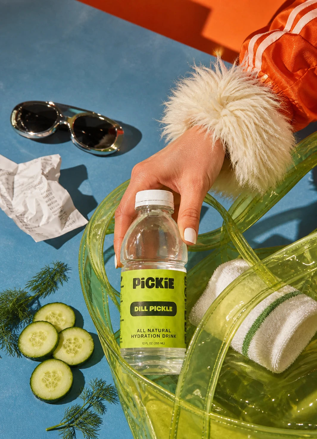 PiCKiE packed in a green bag with cucumber and dill
